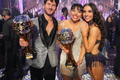 Val Chmerkovskiy, Xochitl Gomez, and Jenna Johnson at the Dancing with the Stars Season 32 finale. Val and Xochitl are holding their trophies.