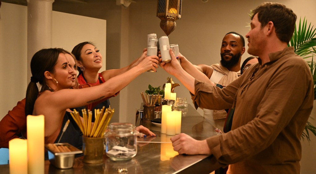 The cast of Gordon Ramsay's Food Stars sharing a drink toast.