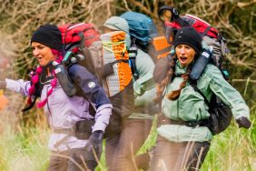 Rhandi and Ashley racing through a field on Race to Survive: New Zealand