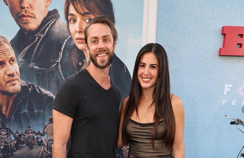 Michelle Lally and her boyfriend Aaron Nosler walk a red carpet.