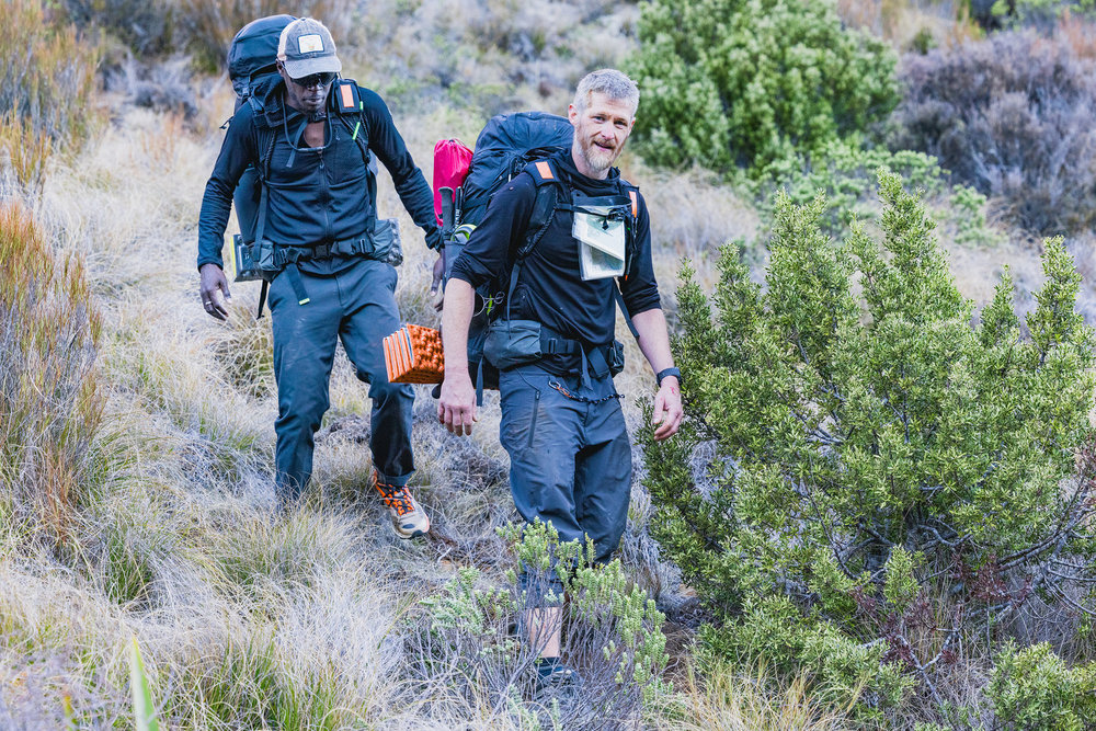 Coree and Jeff on Race to Survive: New Zealand walkng down a hill