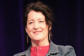 Naomi Pomeroy smiling in front of a purple backdrop