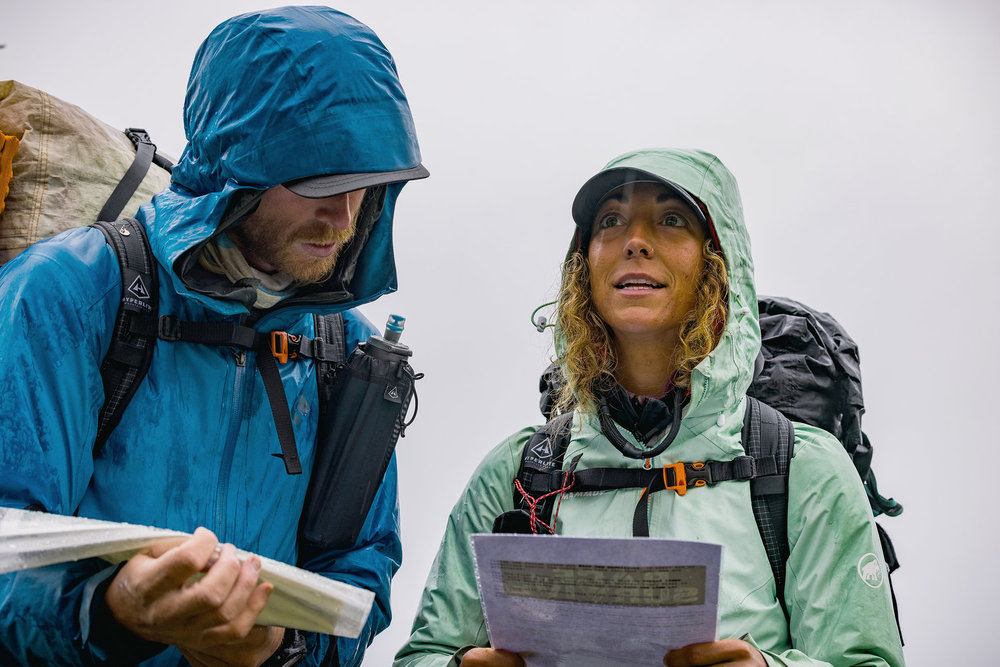 Paulina and Creighton looking at a map on Race to Survive: New Zealand