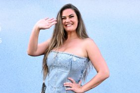 Brittany Cartwright smiling and waving in an interesting denim outfit.