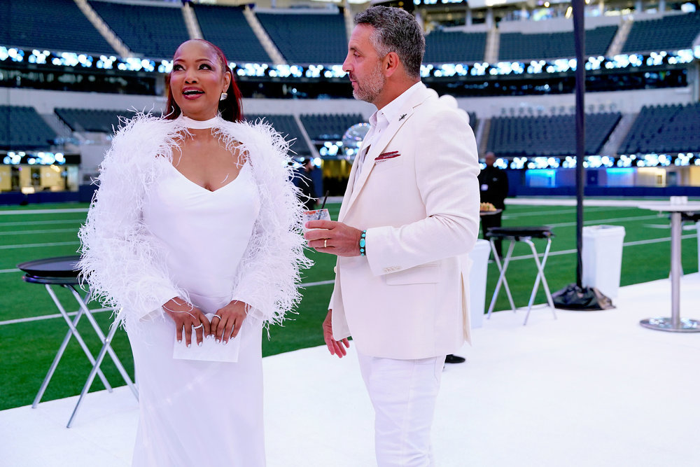 Garcelle Beauvais and Mauricio Umansky filming RHOBH at the White Party.