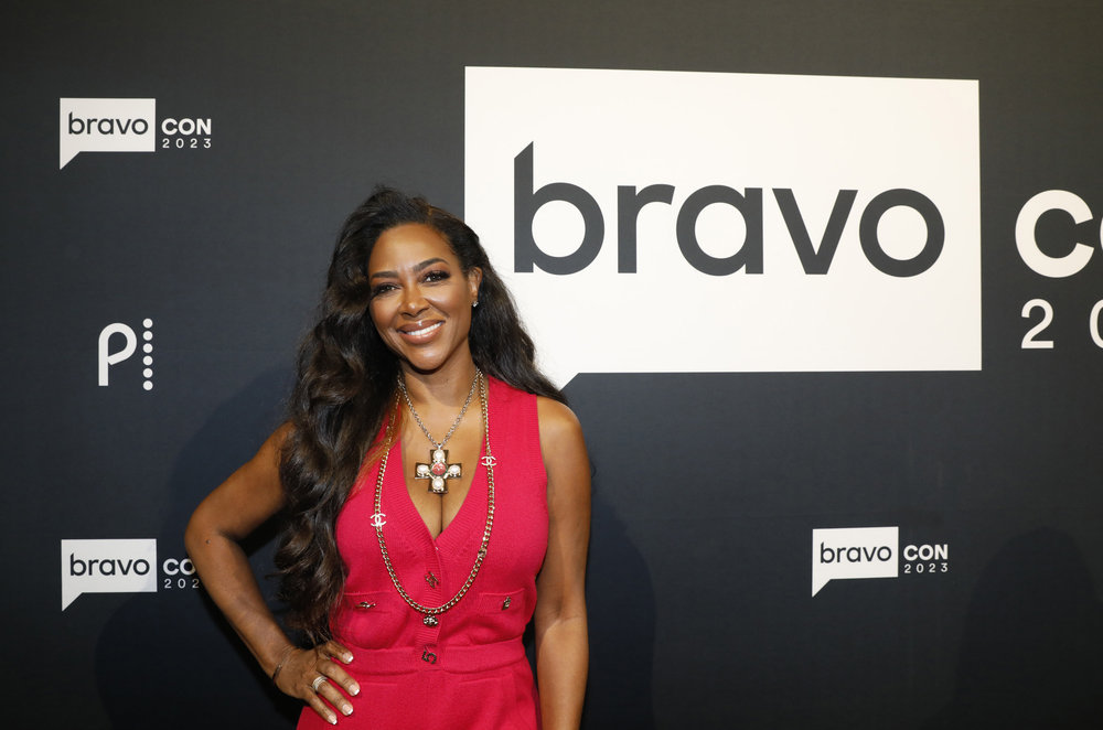 Kenya Moore posing at BravoCon 2023. 