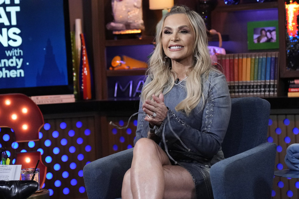 Tamra Judge smiling and clapping on WWHL. 