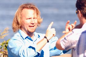 Sister Wives star Kody Brown with the wind in his hair and his hands in the air.