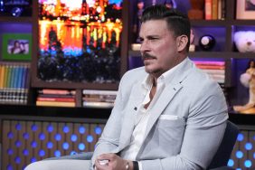 Jax Taylor looking pensive in a light-colored suit on WWHL.