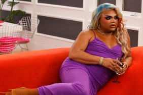 Kandy Muse in a purple dress laying on a couch in House of Villains Season 2