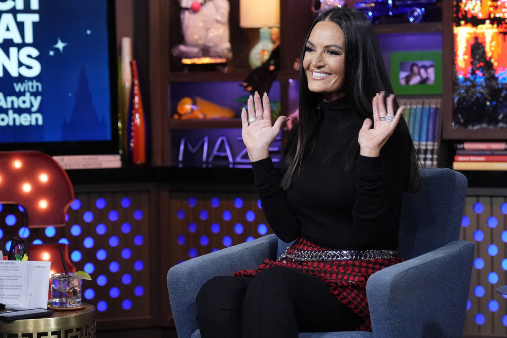 Lisa Barlow raises her hands on WWHL. 