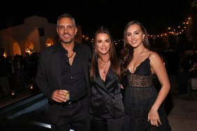 Mauricio Umansky, Kyle Richards, and Alexia Umansky posing together and wearing black at an outdoor event