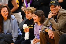Actors Mila Kunis and Ashton Kutcher and their children look on during the WNBA basketball game between the Indiana Fever and the Los Angeles Sparks on May 24, 2024, at Crypto.com Arena in Los Angeles, CA.