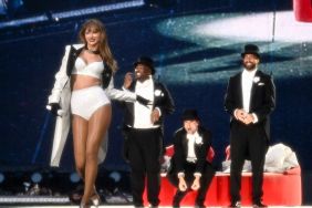 Taylor Swift is joined on stage by Travis Kelce (R), during "Taylor Swift | The Eras Tour" at Wembley Stadium on June 23, 2024 in London, England.