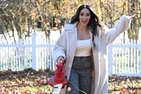 Melissa Gorga with a leaf blower