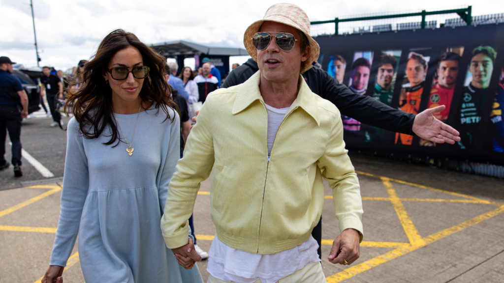 Actor Brad Pitt and girlfriend Ines De Ramon walk in the paddock during the F1 Grand Prix of Great Britain at Silverstone Circuit on July 7, 2024 in Northampton, United Kingdom.