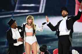 Taylor Swift is joined on stage by Travis Kelce (R), during "Taylor Swift | The Eras Tour" at Wembley Stadium on June 23, 2024 in London, England.