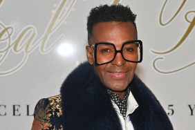RHOA star Dwight Eubanks in large black glasses and a fur collar