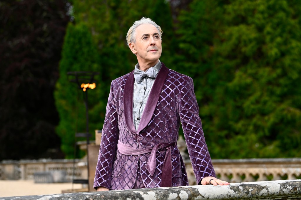 Alan Cumming in a sparkly purple robe on The Traitors