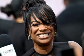 Kandi Burruss grinning on the red carpet at the BET Awards 2025