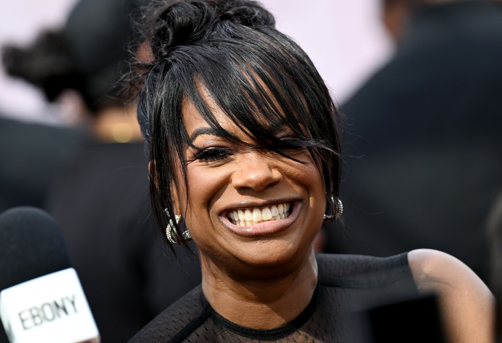Kandi Burruss grinning on the red carpet at the BET Awards 2025
