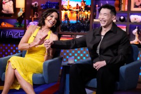 Joel Kim Booster and Luann De Lesseps on Watch What Happens Live, they're laughing and grabbing each other's hands