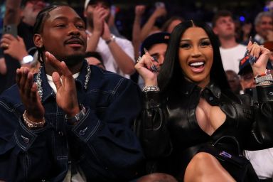 NFL Player Stefon Diggs (R) and rapper Cardi B (L) celebrate in the fourth quarter of Game Four of the Eastern Conference Second Round NBA Playoffs